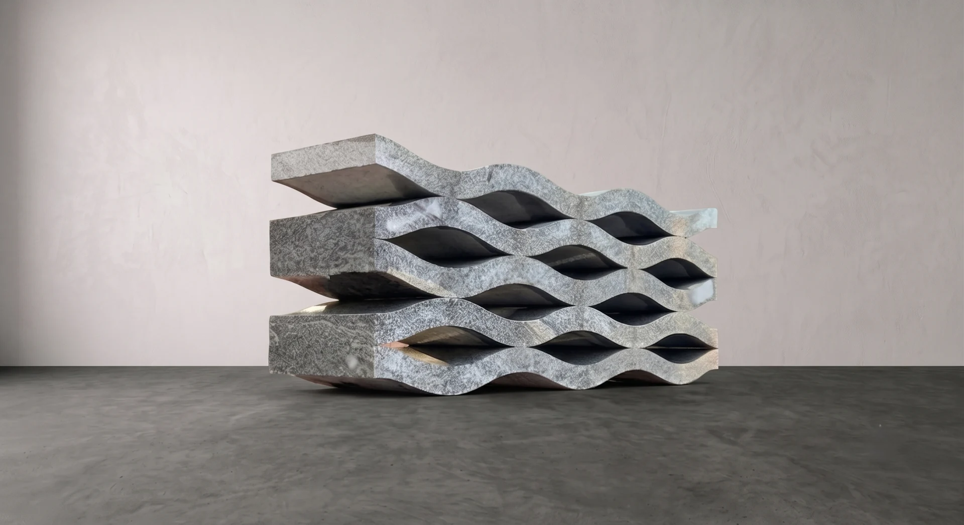 Luxury stone furniture: stacked wave-form granite bench, studio setting
