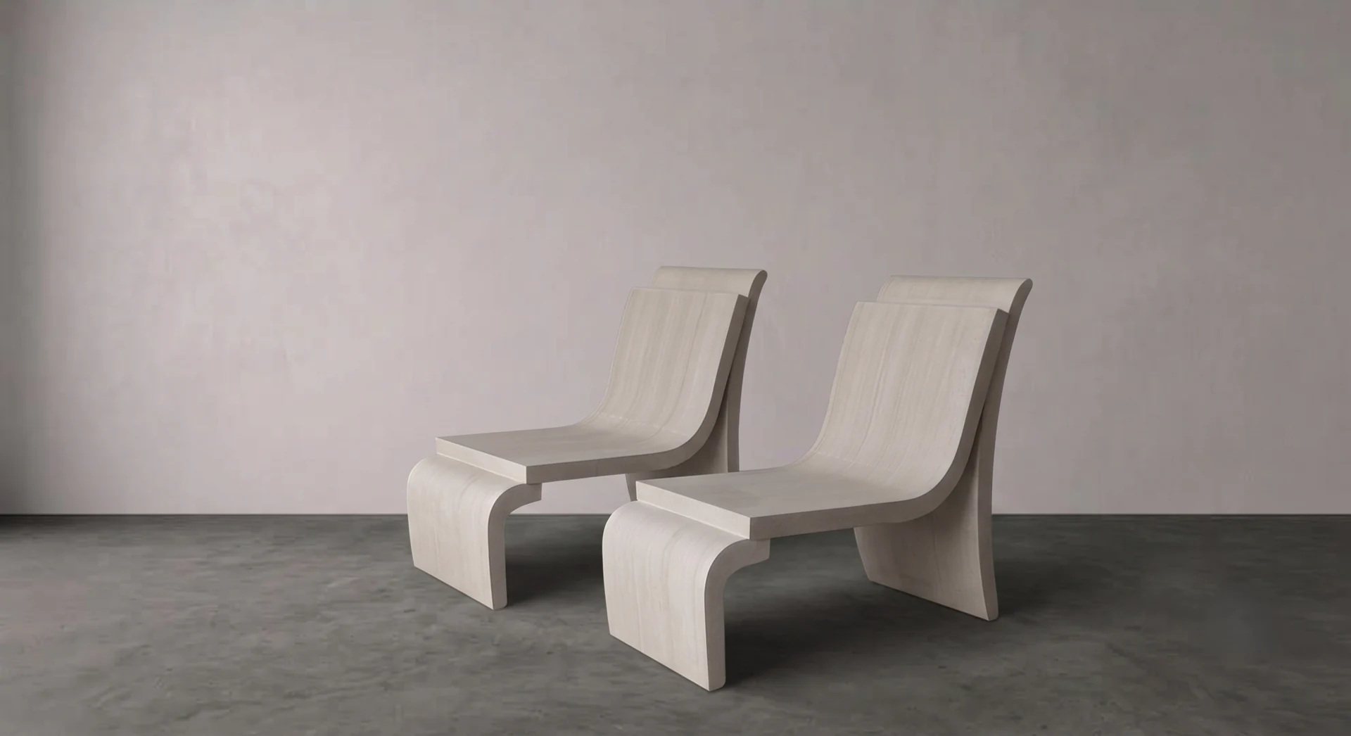 Luxury stone furniture: pair of sandstone lounge chairs, studio setting