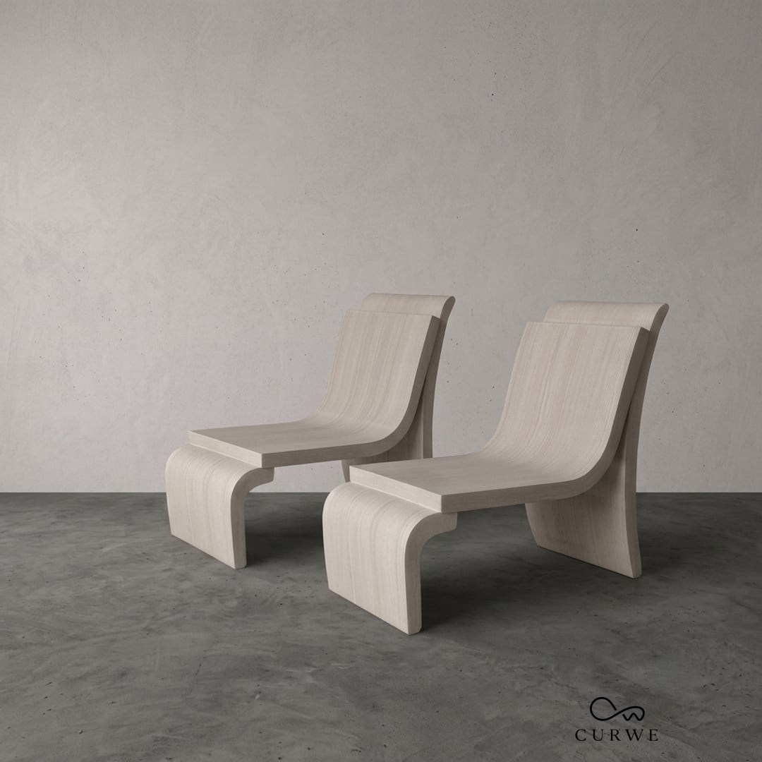 Balanced sandstone lounge chairs with crossed X-form legs