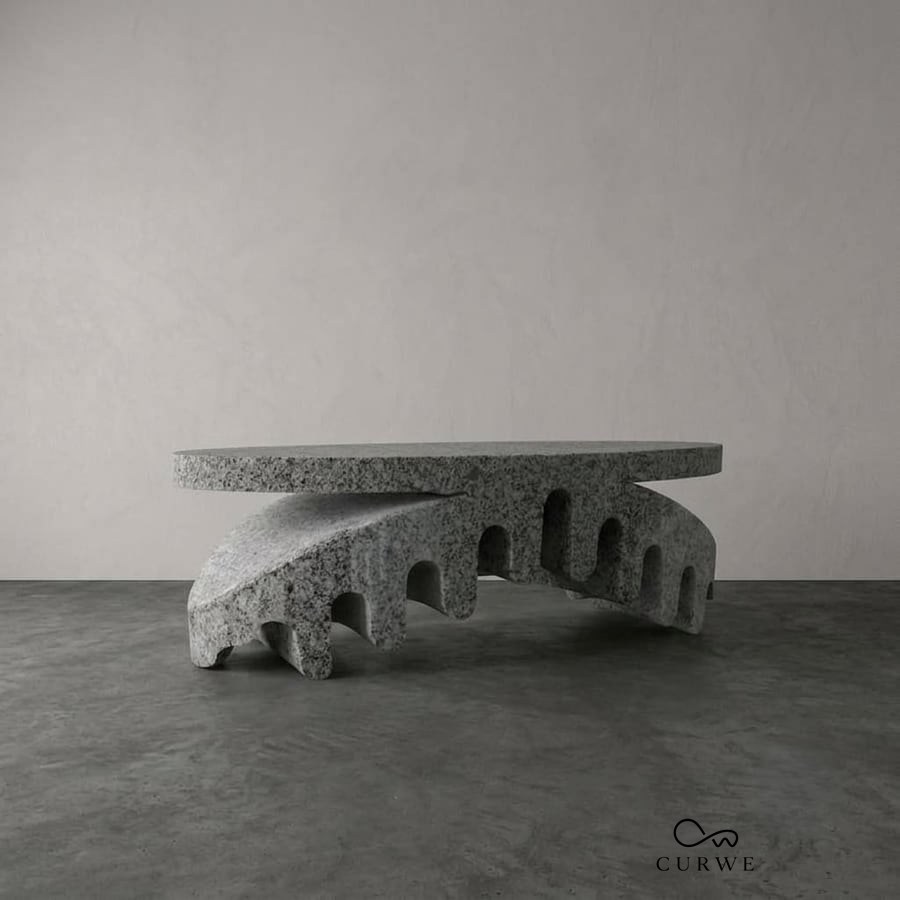 Butterfly oval granite coffee table on a fringed, wing-like base