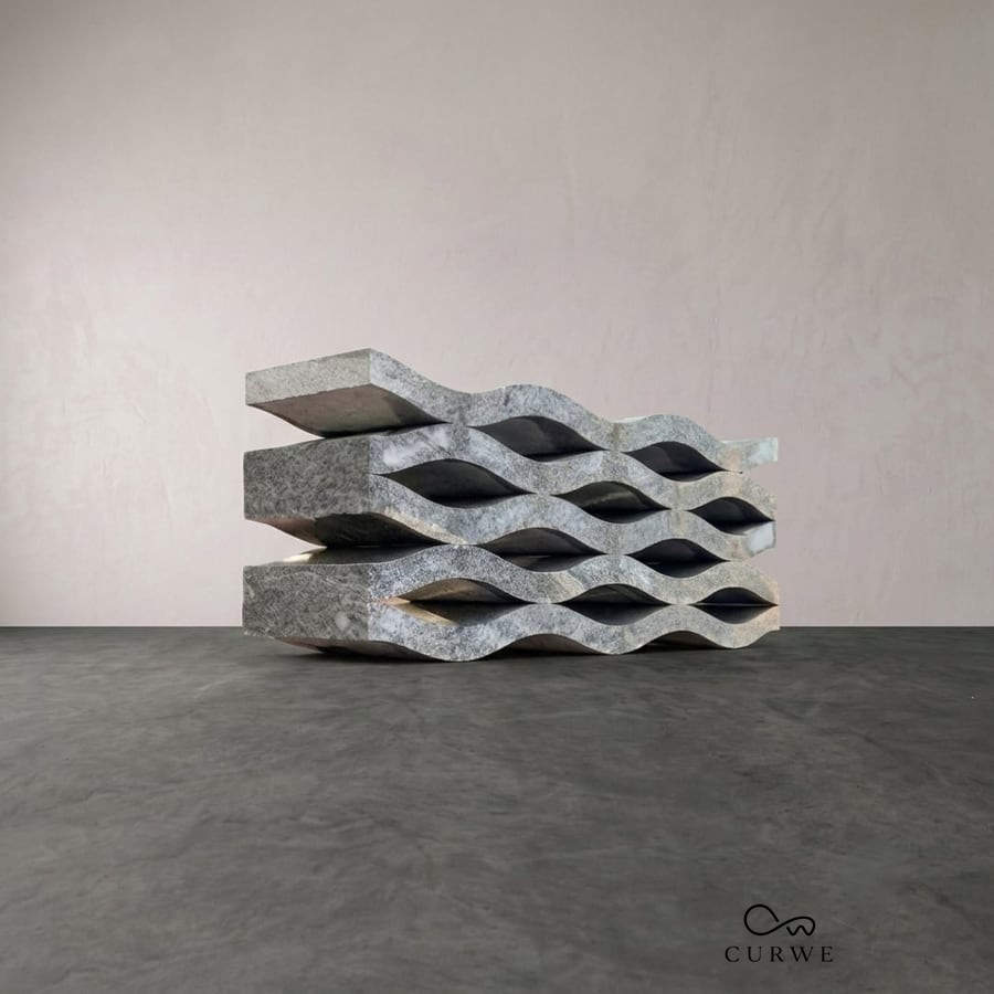Wavey bench built from stacked wave-profile stone slabs