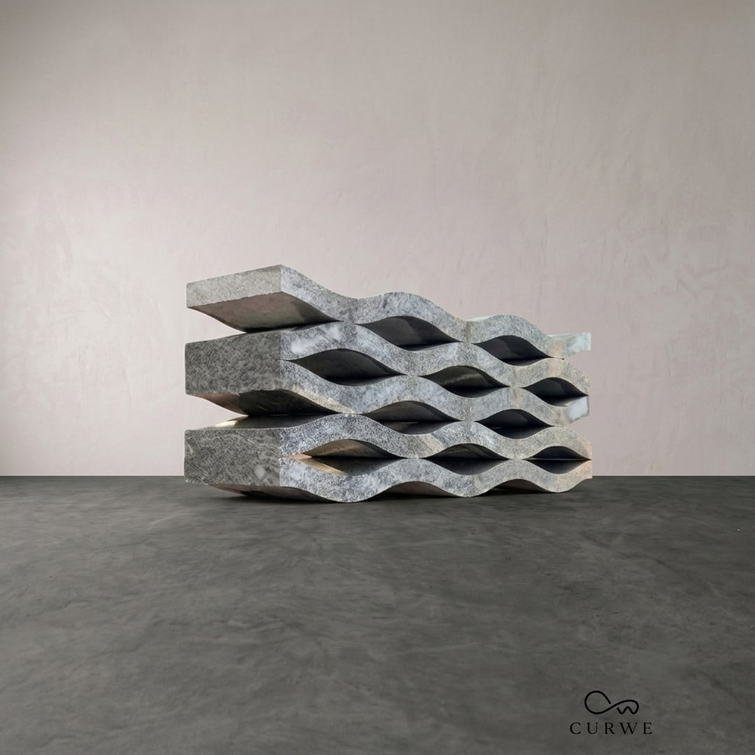 Wavey bench built from stacked wave-profile stone slabs